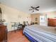 Bedroom featuring carpet flooring, ceiling fan and plenty of space at 5027 Forest Crest Dr, Lakeland, FL 33810