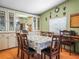 Elegant dining room with a classic table set for eight, complemented by built-in cabinetry for refined storage and display at 5027 Forest Crest Dr, Lakeland, FL 33810