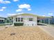 Charming single-story home with a covered carport and a beautiful, low-maintenance rock garden at 5027 Forest Crest Dr, Lakeland, FL 33810