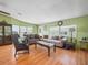 Inviting living room with hardwood floors, comfortable seating arrangements, and natural light at 5027 Forest Crest Dr, Lakeland, FL 33810
