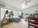 Bright sunroom area, with an elliptical machine, small trampoline, and lots of natural light at 5027 Forest Crest Dr, Lakeland, FL 33810