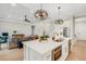 Stylish kitchen with a large island, modern appliances, and open layout to the living area at 5374 Clubhouse Hills Ln, Lakeland, FL 33812
