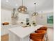 Beautiful kitchen featuring a large island, modern appliances, and elegant lighting at 5374 Clubhouse Hills Ln, Lakeland, FL 33812