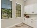 Laundry room with ample storage, large windows, and modern appliances at 5374 Clubhouse Hills Ln, Lakeland, FL 33812