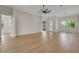 Spacious living room features hardwood floors, high ceilings, modern lighting, and large windows at 5374 Clubhouse Hills Ln, Lakeland, FL 33812