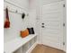 Mud room with a built-in bench, storage cubbies, and coat hooks by the front door at 5374 Clubhouse Hills Ln, Lakeland, FL 33812