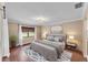 This spacious bedroom is complete with a queen bed, area rug, and a window view at 628 Wexford Ct, Winter Haven, FL 33884