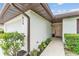 Inviting home entrance with beautiful landscaping, a walkway, and a decorative front door at 628 Wexford Ct, Winter Haven, FL 33884