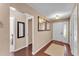 Welcoming foyer with hardwood floors, decorative mirrors, and neutral paint at 628 Wexford Ct, Winter Haven, FL 33884