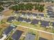 An aerial view of modern homes in a planned community, showcasing landscaping and neighborhood layout at 6627 Ridgemont Rd, Lakeland, FL 33813