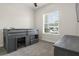 Bedroom featuring a bunkbed, modern color scheme, and large windows for ample natural light at 6627 Ridgemont Rd, Lakeland, FL 33813