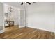 Light-filled bedroom featuring hardwood floors and a view into another room at 6627 Ridgemont Rd, Lakeland, FL 33813