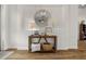 Elegant foyer with wood-look flooring, shiplap wall decor, and a decorative mirror at 6627 Ridgemont Rd, Lakeland, FL 33813