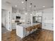Modern kitchen featuring a large island, pendant lighting, and stainless steel appliances at 6627 Ridgemont Rd, Lakeland, FL 33813
