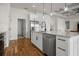 Bright kitchen features white cabinets, stainless appliances, island with marble counters, and modern finishes at 6627 Ridgemont Rd, Lakeland, FL 33813