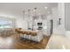 Open kitchen and dining area with an island, bar stools, and lots of natural light at 6627 Ridgemont Rd, Lakeland, FL 33813