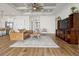 Large, open living room with an open floor plan and connection to the kitchen at 6627 Ridgemont Rd, Lakeland, FL 33813