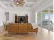 Bright living room boasting a decorative ceiling, and sliding glass doors to the lanai at 6627 Ridgemont Rd, Lakeland, FL 33813
