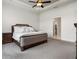 Comfortable main bedroom featuring neutral carpet, a large bed, and ample space at 6627 Ridgemont Rd, Lakeland, FL 33813