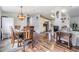 Open-concept dining area leading to the kitchen and living room, perfect for entertaining guests at 7011 Tall Pine Rd, Polk City, FL 33868