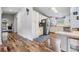 Spacious kitchen featuring stainless steel appliances, white cabinets, and wood flooring at 7011 Tall Pine Rd, Polk City, FL 33868