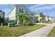 The home features a well-manicured lawn, covered entry, and an attached two-car garage at 871 Fillmore Ct, Davenport, FL 33837
