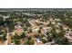 An aerial view of a neighborhood, showcasing the variety of houses and foliage, with a focus on a specific home indicated by an arrow at 101 S Cleveland Ave, Fort Meade, FL 33841