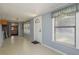 Bright bonus room with light blue walls, and a door leading to the garage at 101 S Cleveland Ave, Fort Meade, FL 33841