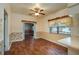 Bright dining area featuring hardwood floors, ceiling fan and natural light from the window at 101 S Cleveland Ave, Fort Meade, FL 33841