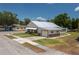 A view of the single story home with a new metal roof, and an attached one car garage at 101 S Cleveland Ave, Fort Meade, FL 33841