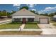 Charming single-story home with manicured lawn and attached one car garage in a sunny neighborhood at 101 S Cleveland Ave, Fort Meade, FL 33841