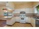 Bright kitchen with light cabinetry, tiled floor, and large window for natural light at 101 S Cleveland Ave, Fort Meade, FL 33841