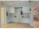 Functional kitchen area featuring ample storage and tiled flooring at 101 S Cleveland Ave, Fort Meade, FL 33841