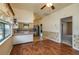 Kitchen boasts ample countertops, wood floors and a ceiling fan; bright with natural light at 101 S Cleveland Ave, Fort Meade, FL 33841
