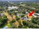Beautiful aerial view of a home with a pool, near a lake and highway access at 1205 Rolling Woods Ln, Lakeland, FL 33813