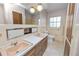 Bathroom featuring double sinks, ample cabinet space, and a large mirror at 1205 Rolling Woods Ln, Lakeland, FL 33813