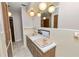 Bathroom featuring double sinks, ample cabinet space, and a large mirror at 1205 Rolling Woods Ln, Lakeland, FL 33813