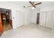 Spacious bedroom with multiple closets and ceiling fan at 1205 Rolling Woods Ln, Lakeland, FL 33813