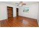 Light and bright bedroom with hardwood floors, window, and cedar lined closet at 1205 Rolling Woods Ln, Lakeland, FL 33813