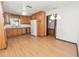 Kitchen features wood cabinets, stainless steel appliances, and laminate flooring, providing functionality and a welcoming atmosphere at 1205 Rolling Woods Ln, Lakeland, FL 33813