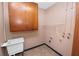 Small laundry room with utility sink and storage at 1205 Rolling Woods Ln, Lakeland, FL 33813