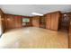 Wood paneled living room with linoleum flooring, built-in shelves, and small window at 1205 Rolling Woods Ln, Lakeland, FL 33813