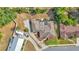 Overhead aerial view of the home highlighting the roof, enclosed pool, and large driveway with RV parking at 1433 Ellison Ln, Lakeland, FL 33801