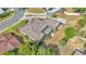 Bird's-eye view showcasing the home's layout, screened patio, landscaping, and proximity to other residences at 1433 Ellison Ln, Lakeland, FL 33801