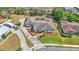 Aerial view of a single-Gathering home with neutral exterior, screened lanai, updated landscaping and ample parking at 1433 Ellison Ln, Lakeland, FL 33801