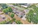Overhead aerial shot of a home with a large screened in porch and RV Parking, nestled among lush trees at 1433 Ellison Ln, Lakeland, FL 33801