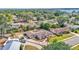 Sprawling single story home with screened in lanai, mature trees, and long driveway with ample parking at 1433 Ellison Ln, Lakeland, FL 33801