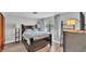Bedroom featuring a bed frame, neutral walls, wood floors and a window with natural light at 1433 Ellison Ln, Lakeland, FL 33801