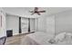 Bedroom featuring a ceiling fan, neutral paint, and wood-look flooring at 1433 Ellison Ln, Lakeland, FL 33801