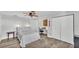 Bedroom with ceiling fan, gray walls, wood floors and built in desk and shelving at 1433 Ellison Ln, Lakeland, FL 33801